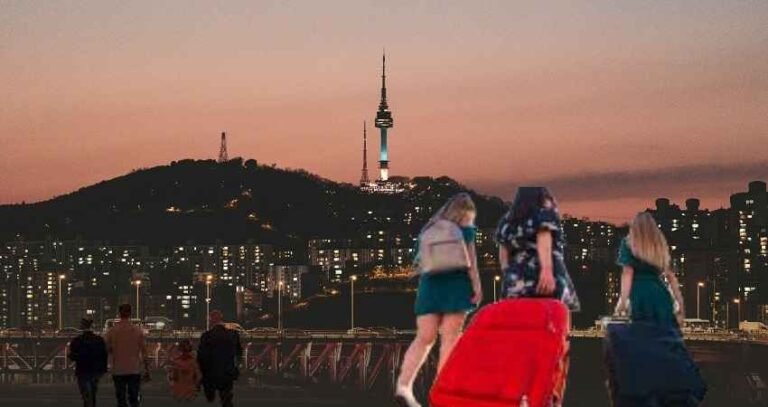 A group of travelers with their suitcases are walking in the direction of a city skyline lit up by the sun going down, which is a metaphor for the affordable journeys that have been made easy by the use of discount codes TTweakAirline by ​‍​‌‍​‍‌​‍​‌‍​‍‌TravelTweaks.